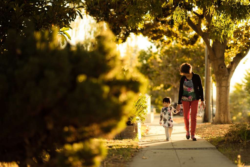 Two people walking in The Woodlands.