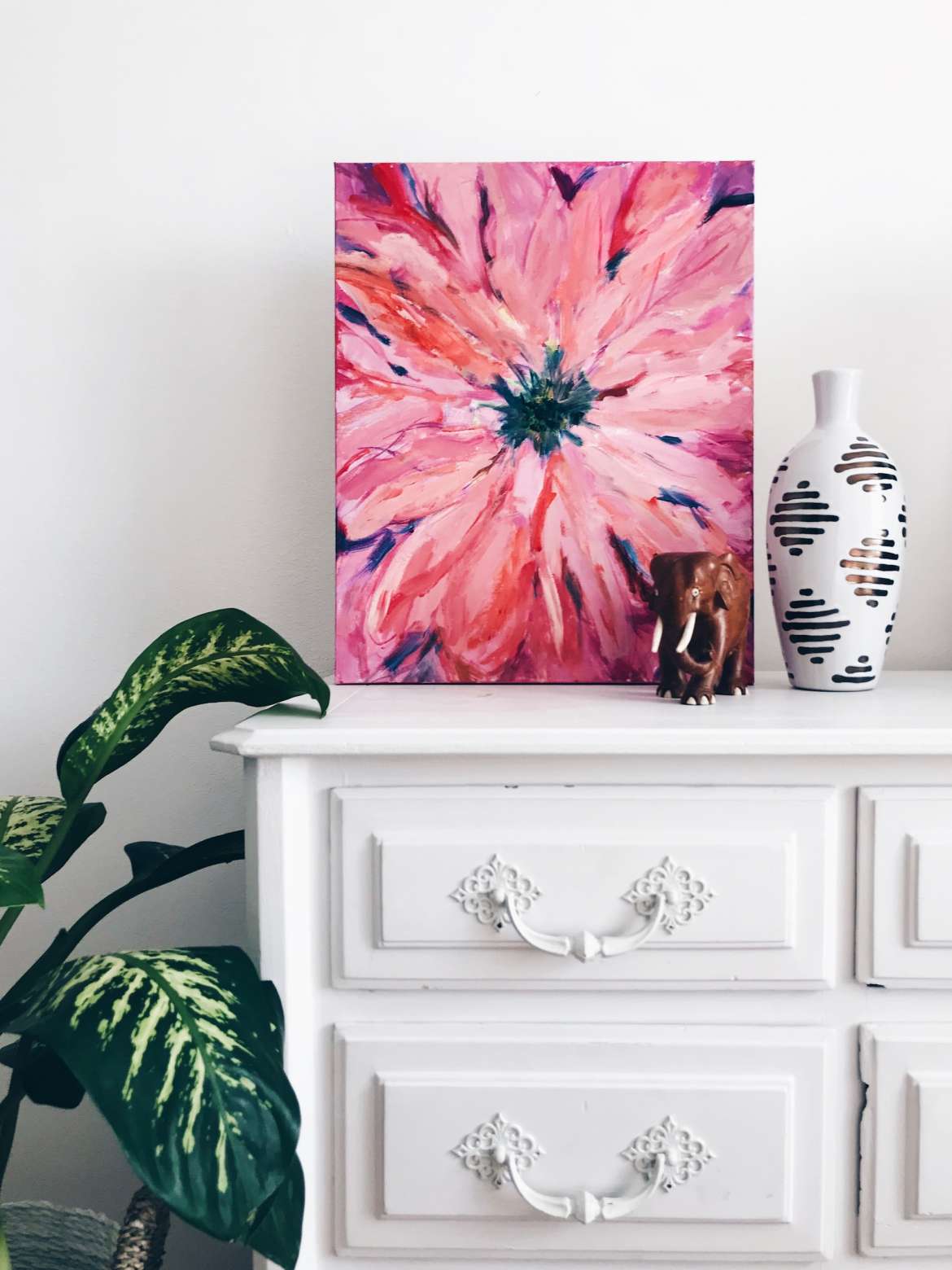 pink painting on white chest