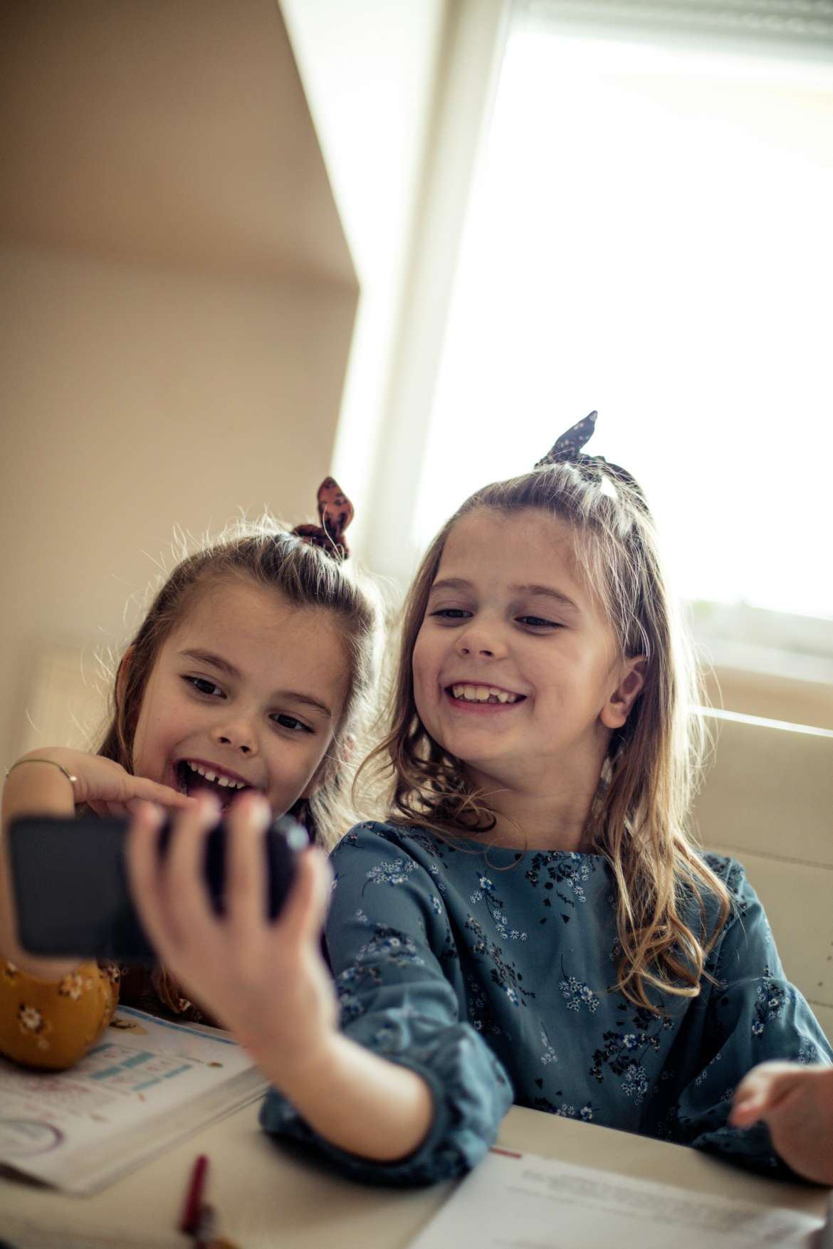two girls looking at a phone